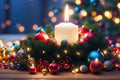 Decorative Christmas wreath with a lit candle and colorful ornaments on a wooden surface.