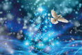 White dove flying in a mystical blue and purple sky with stars and light effects.
