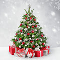 Decorated Christmas tree with ornaments and presents against a snowy background