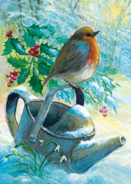 Bird perched on a snow-covered teapot with holly and berries in the background
