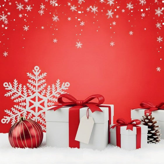 White gift boxes tied with red ribbons and bows, arranged on a white snowy surface against a bright red background with falling snowflakes, a large white snowflake cutout, a red ornament, and a pinecone.