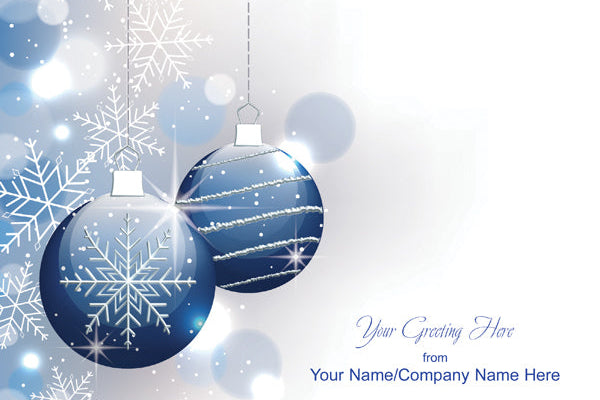 Blue Christmas ornaments with snowflakes on a light blue background